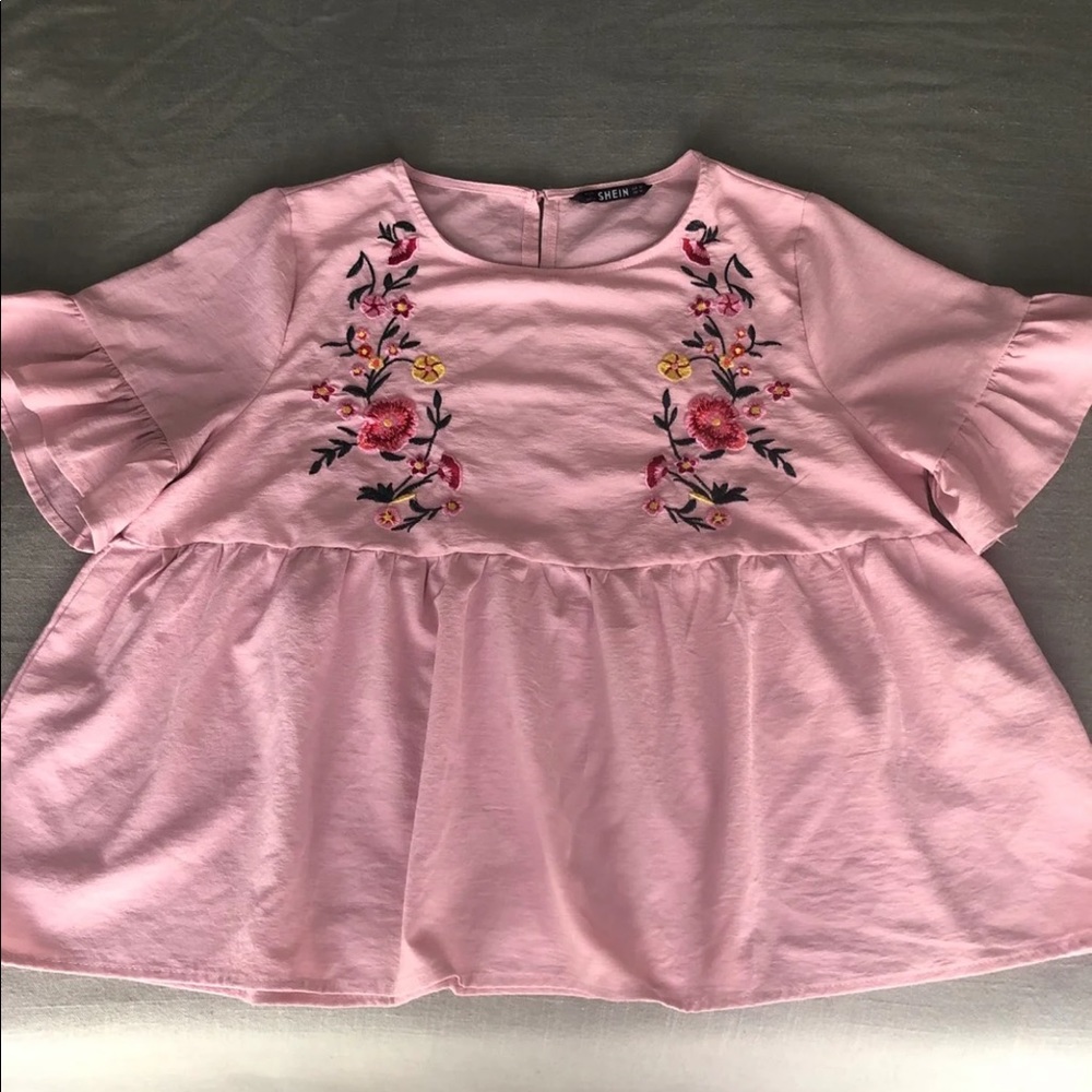 Light pink blouse with embroidered details